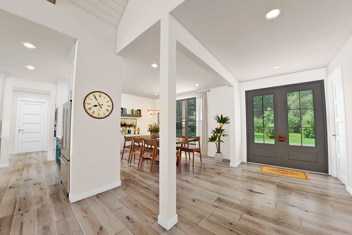 Interior rendering of a house entry with double doors, dining area, and kitchen view. Features include vaulted ceiling and wood flooring.