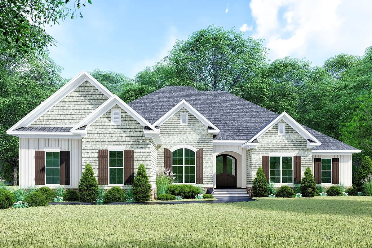 House plan exterior. One-story Craftsman home with gabled roof, shake siding, and arched entry. Features include shutters and dormers.