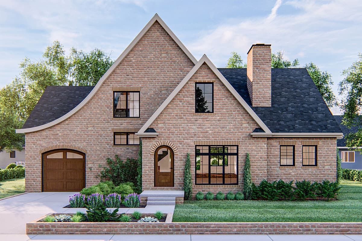 House plan exterior: Brick two-story home with arched entryway, prominent gable, dormers, and side-entry garage.