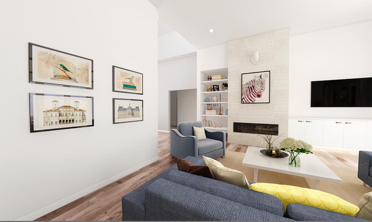 Modern living room with fireplace, built-in shelves, artwork, and a large sectional sofa.