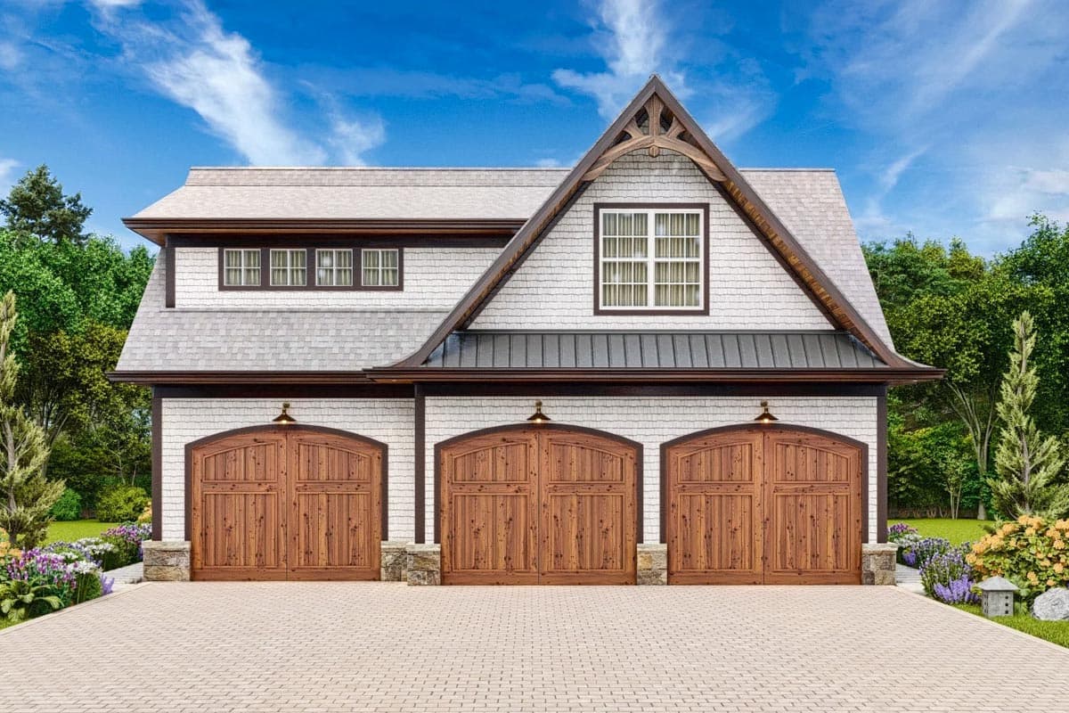 House plan exterior with three arched wooden garage doors, white shingle siding, and a prominent gable with decorative wood trim.
