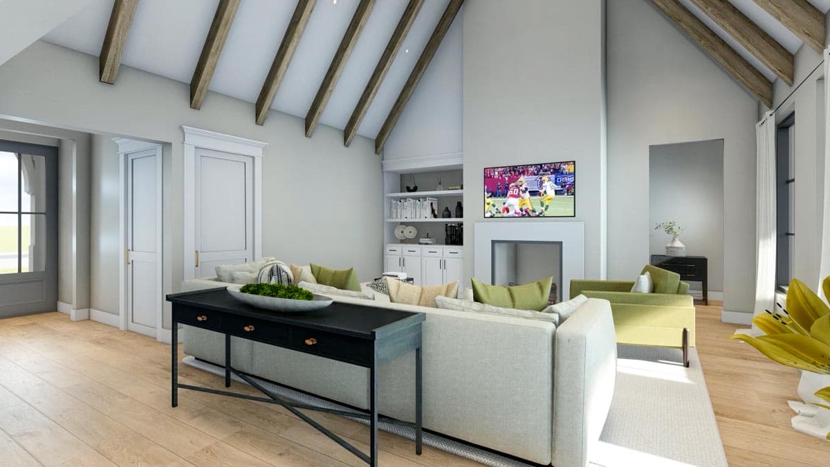 Great room with vaulted beamed ceiling, fireplace, built-in shelving, and large windows.