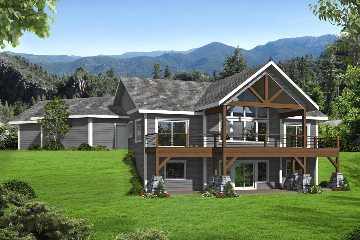 House plan exterior. Two-story home with gable roof, elevated deck supported by stone piers, and a large windowed gable over the entry.