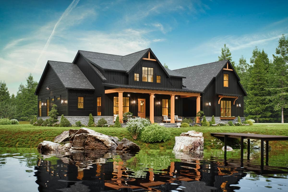Modern Farmhouse house plan exterior with dark siding, wood-trimmed covered porch, gables, and stone foundation.