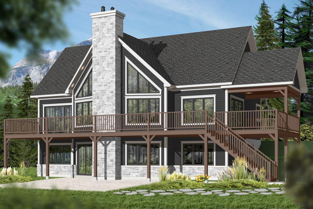House plan exterior. Two-story, with gabled roof, stone chimney, and wraparound deck. Features include large windows and a covered porch area.
