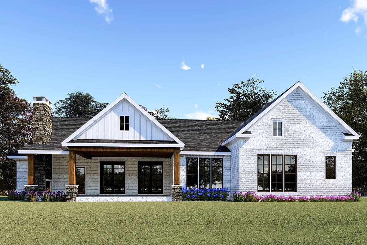 Modern Farmhouse house plan exterior with white brick, gabled dormers, covered porch, and stone chimney.