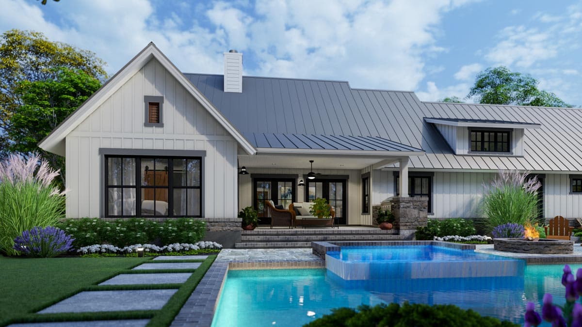 A modern farmhouse with a pool, patio, and outdoor fireplace. The house features a white exterior, gray roof, and black-framed windows.