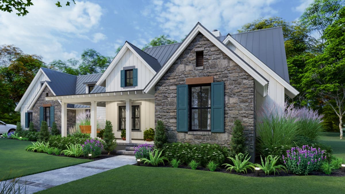 A modern, well-landscaped house with a stone facade, teal shutters, and a gray metal roof, set against a backdrop of trees and a blue sky.