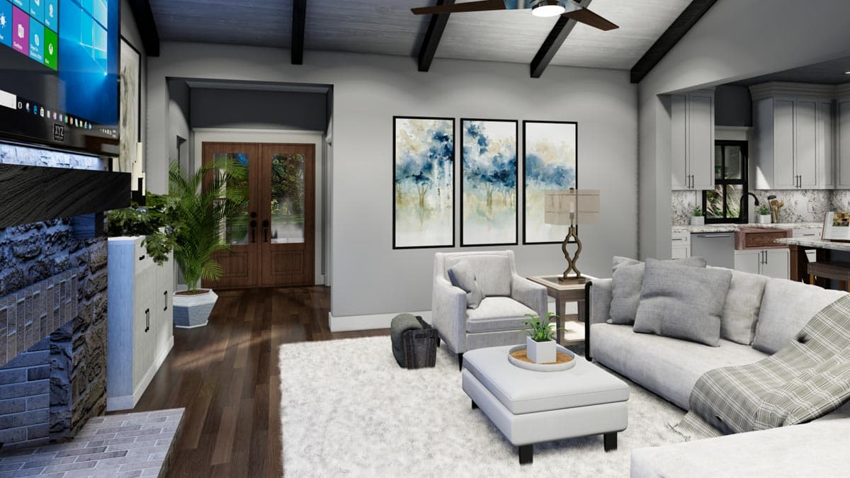 A modern living room featuring a fireplace, art, a seating area, and a view of the entrance door. Interior design emphasizes light colors.