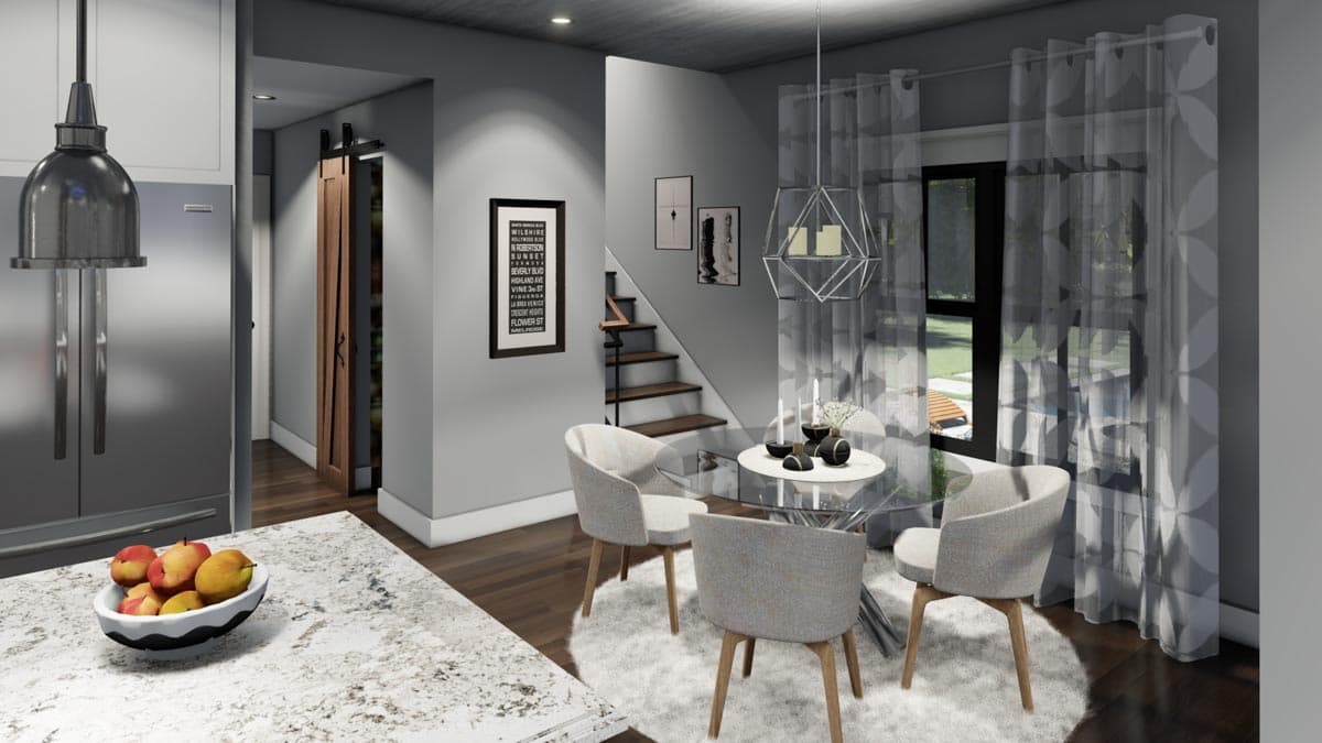 A modern dining area featuring a glass-top table, four chairs, and a geometric chandelier. A staircase leads up to a second floor, and sheer curtains.