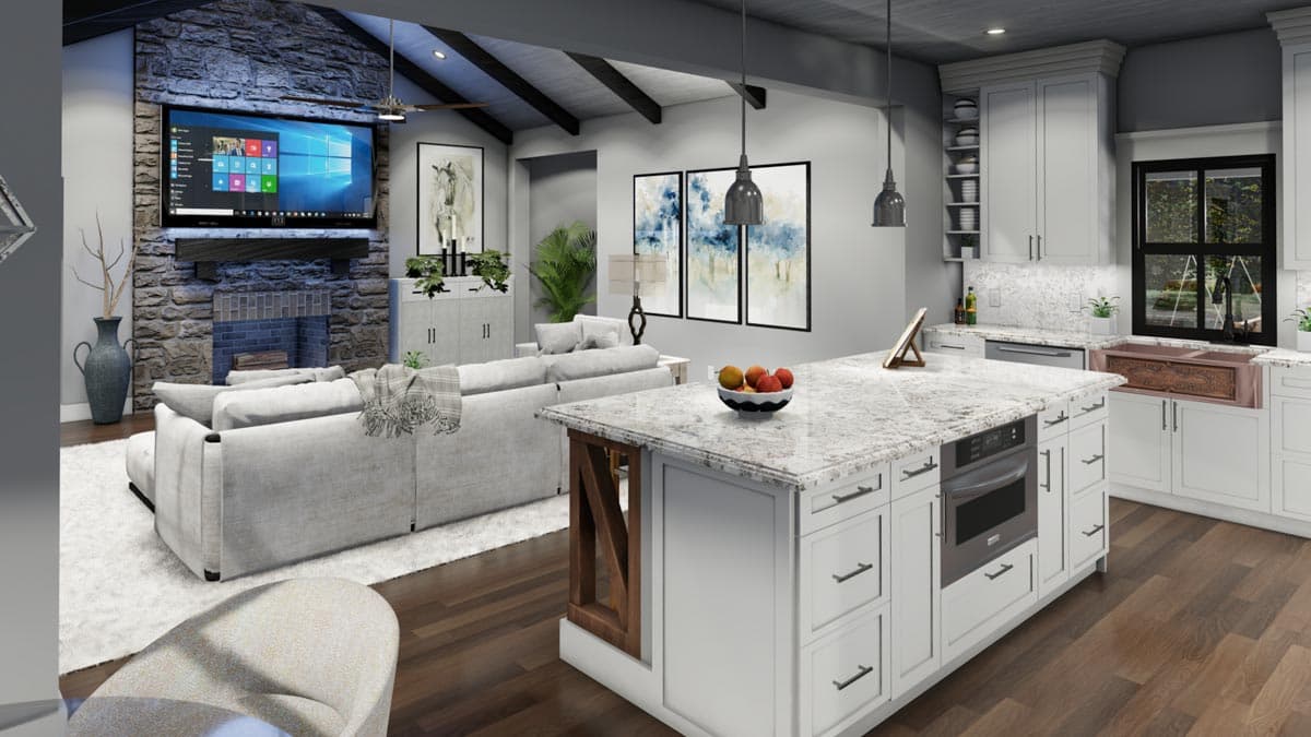 A modern, open-concept living space with a kitchen island, fireplace, and comfortable seating. Artwork and design accents complete the room.