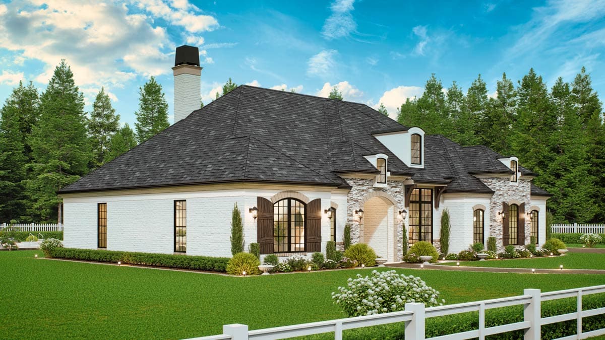 House plan exterior: One-story home with white brick facade, arched windows, stone accents, dormers, and a prominent chimney.