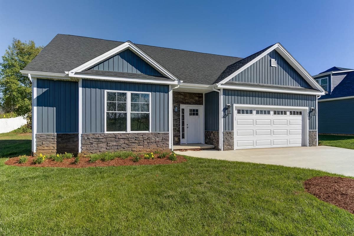 Modern Farmhouse style house plan exterior with board and batten siding, stone accents, gable roof, and attached two-car garage.