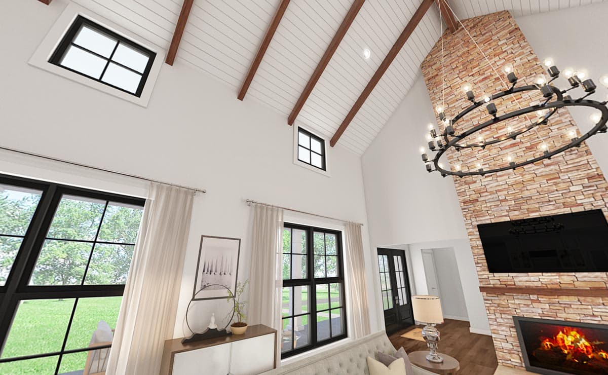 Interior rendering: Great room with vaulted beamed ceiling, stone fireplace, large windows, and modern chandelier.