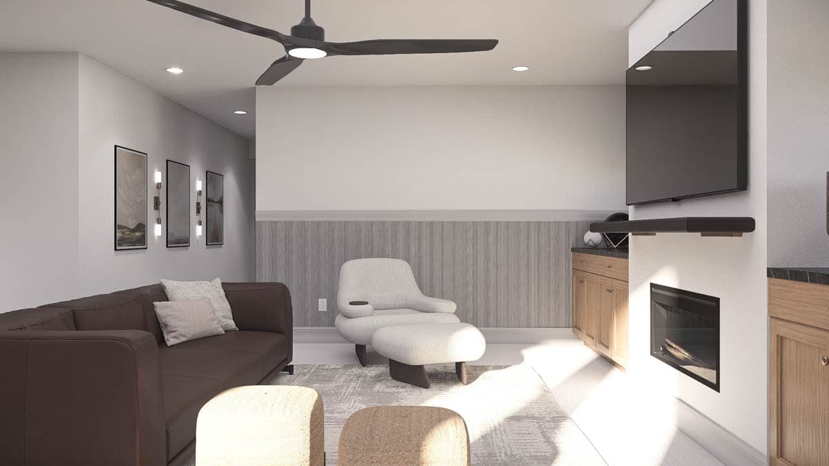 Modern living room featuring a brown sofa, a white armchair with ottoman, a fireplace, and a large TV mounted on the wall.