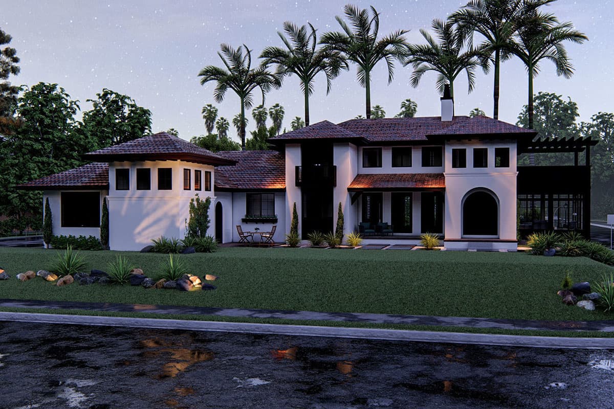 House plan exterior: Two-story Mediterranean style with red tile roof, arched entryway, circular tower, and covered patio.