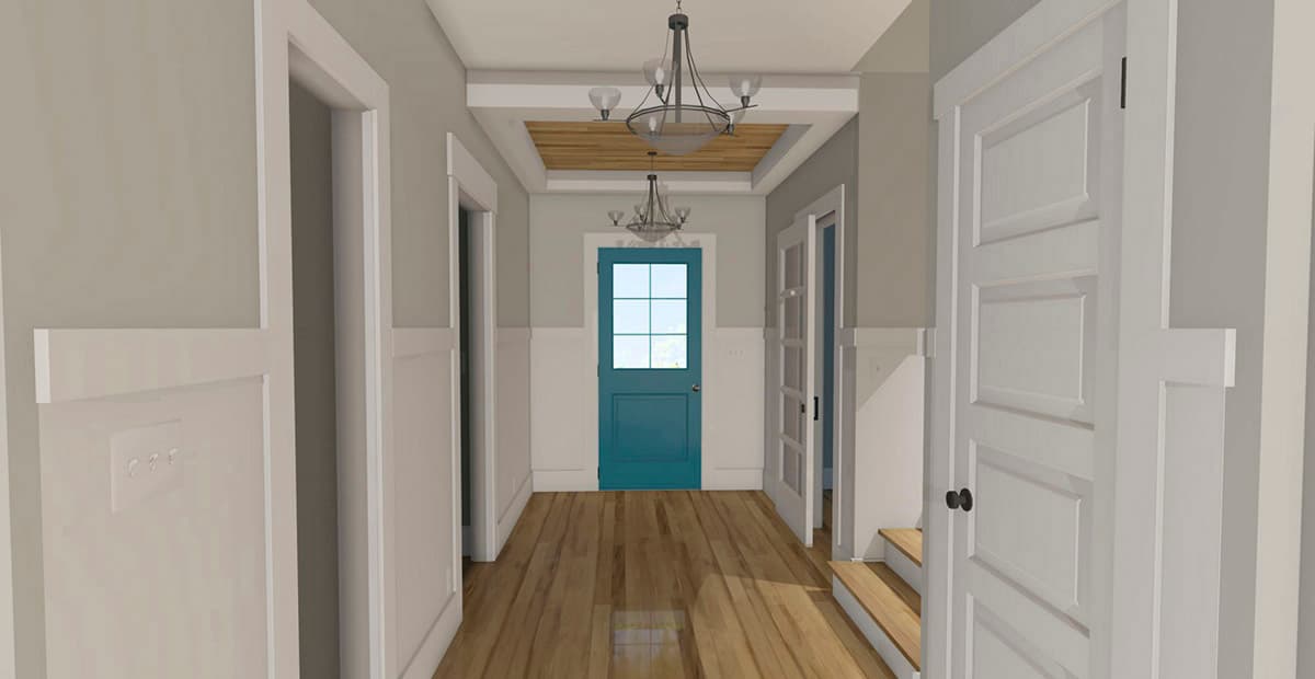 Interior view of a hallway with a blue door, paneled wainscoting, wood floors, and two chandeliers.