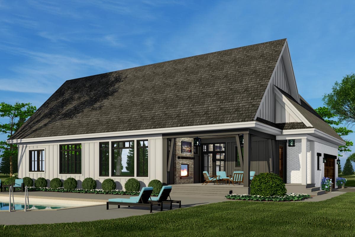 Modern house plan exterior with gabled roof, board and batten siding, stone-clad outdoor fireplace, and attached garage.