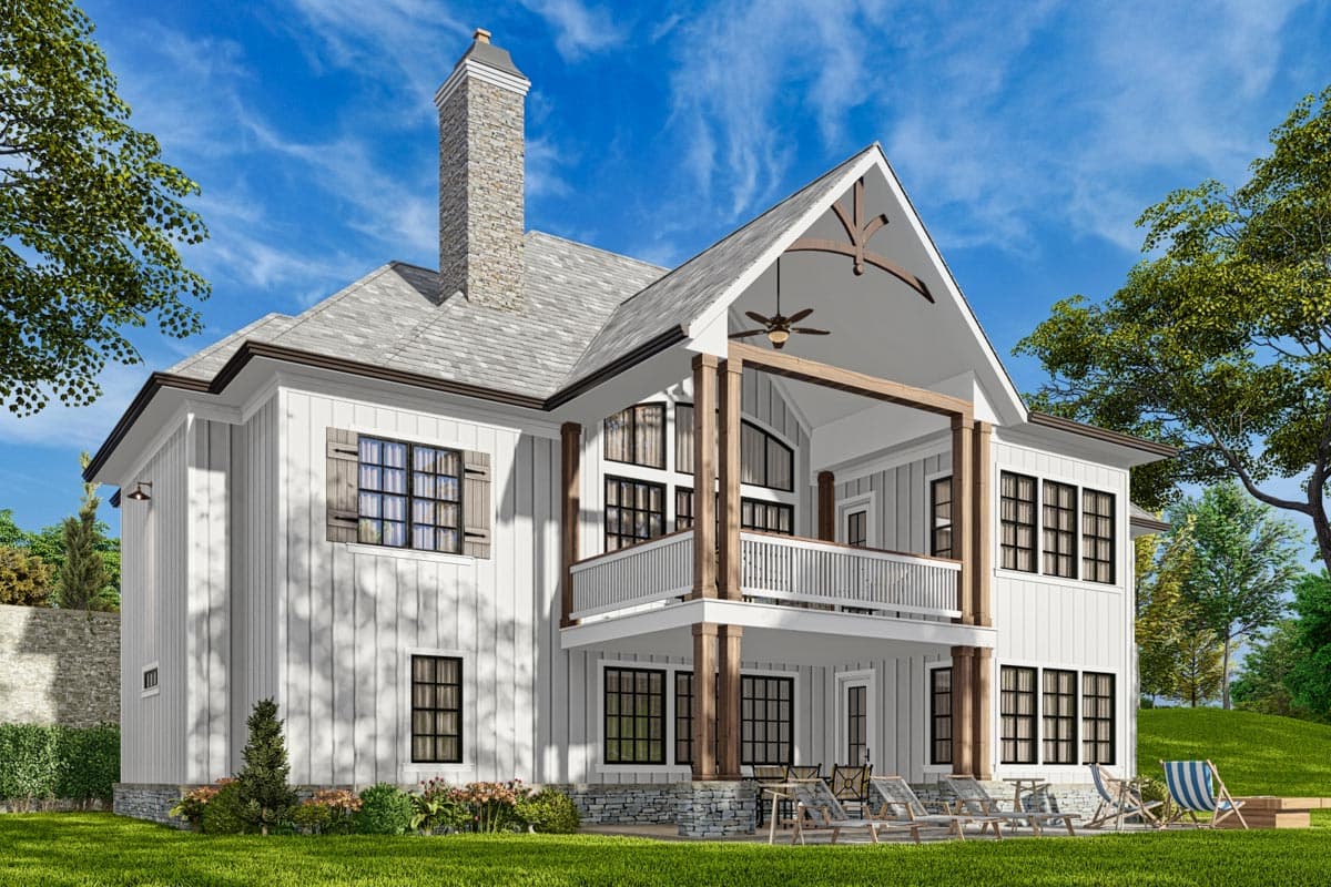 Modern Farmhouse house plan exterior with board and batten siding, stone chimney, and covered balconies.