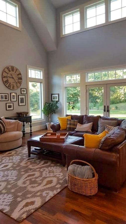 Great room with vaulted ceiling, large windows, and French doors leading outside.