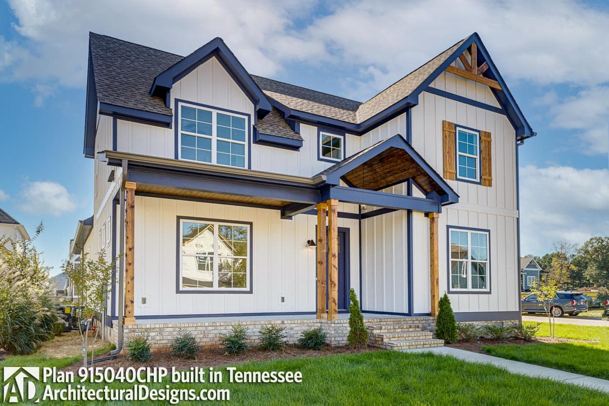 Modern Farmhouse house plan exterior with board and batten siding, prominent gables, and exposed wood beams on covered porch.