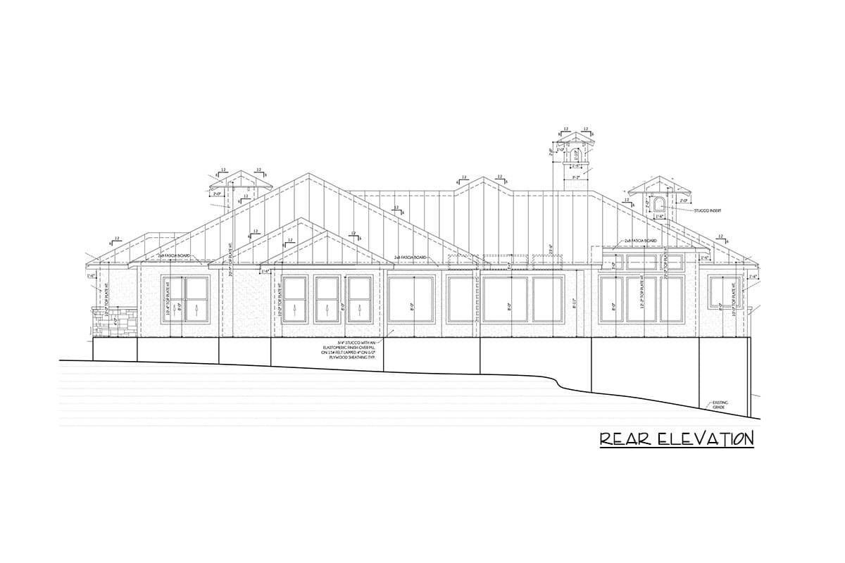 Rear elevation drawing showing a house plan with multiple gables, varied window configurations, and stucco insert detail.