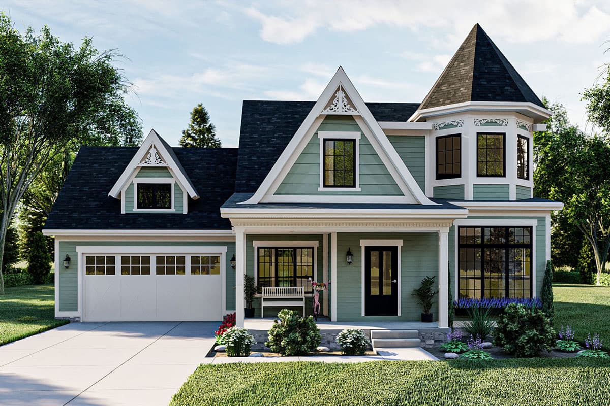 House plan exterior. Two-story Victorian-style home with a turret, multiple gables, a covered porch, and a garage with overhead door.