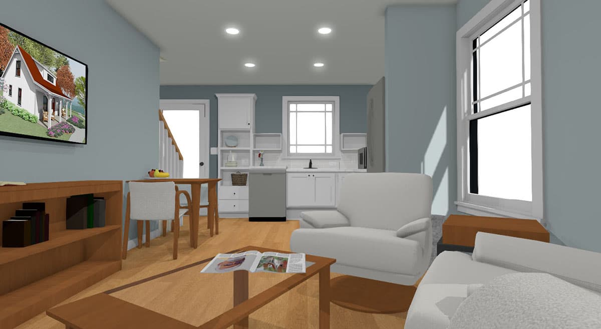 Interior view of an open-plan living area with kitchen, dining nook, and sofa.