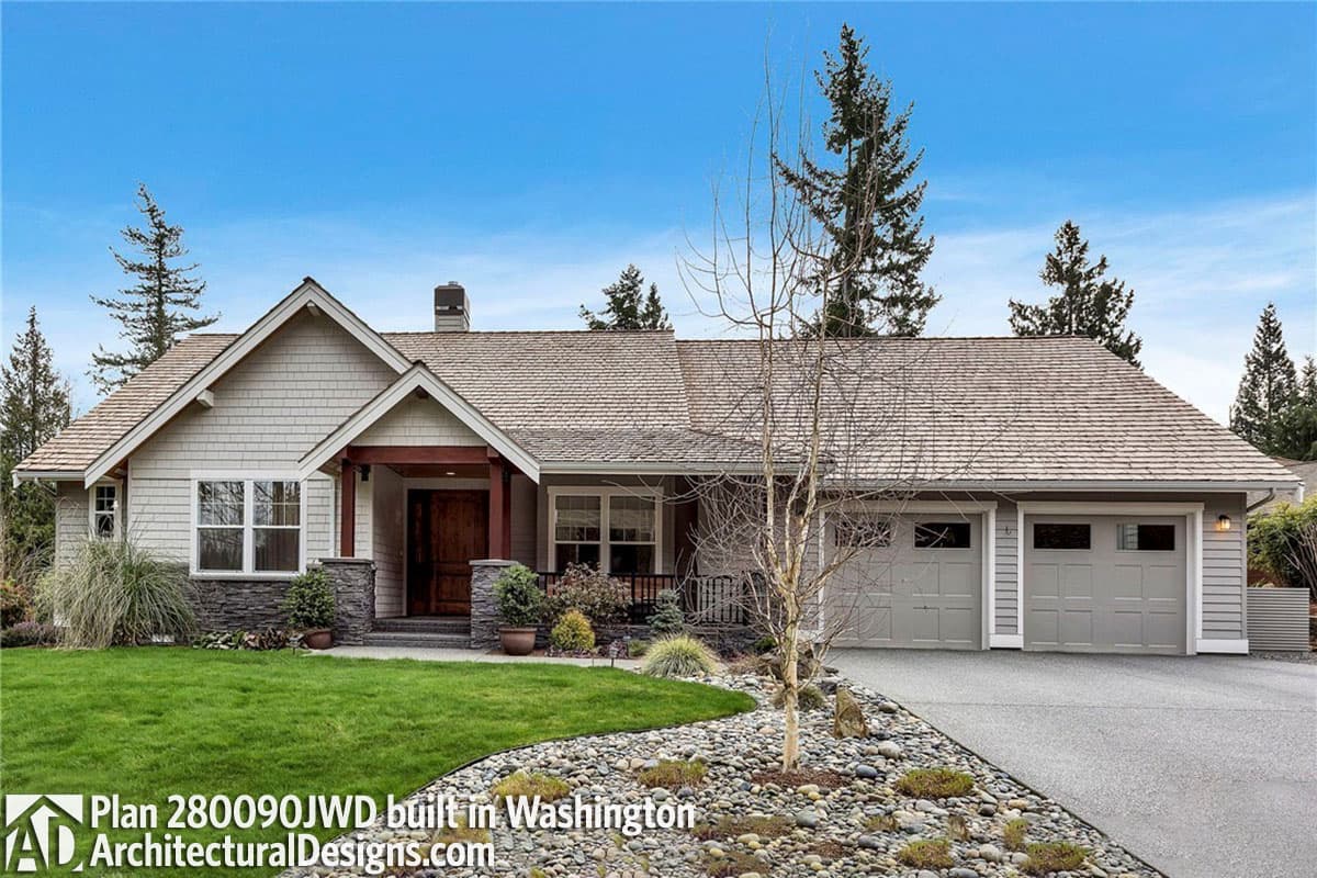 House plan exterior: Ranch style, wood shake roof, covered entryway with wood posts, dual garage doors.