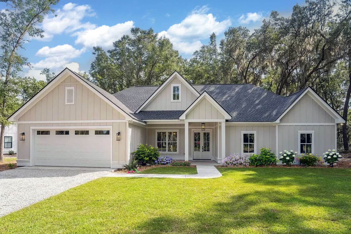 Modern Farmhouse house plan exterior, one story, with attached garage, gable rooflines, and a covered front porch.