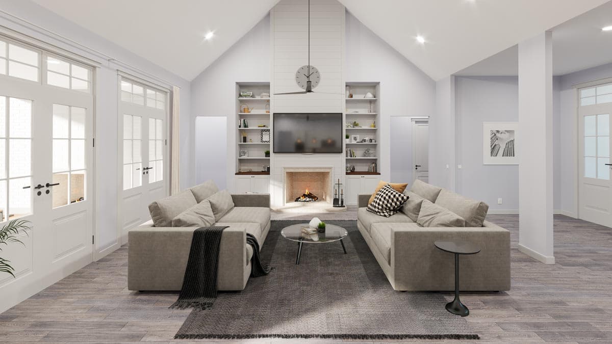 Great room with vaulted ceiling, fireplace, built-ins, and double French doors.
