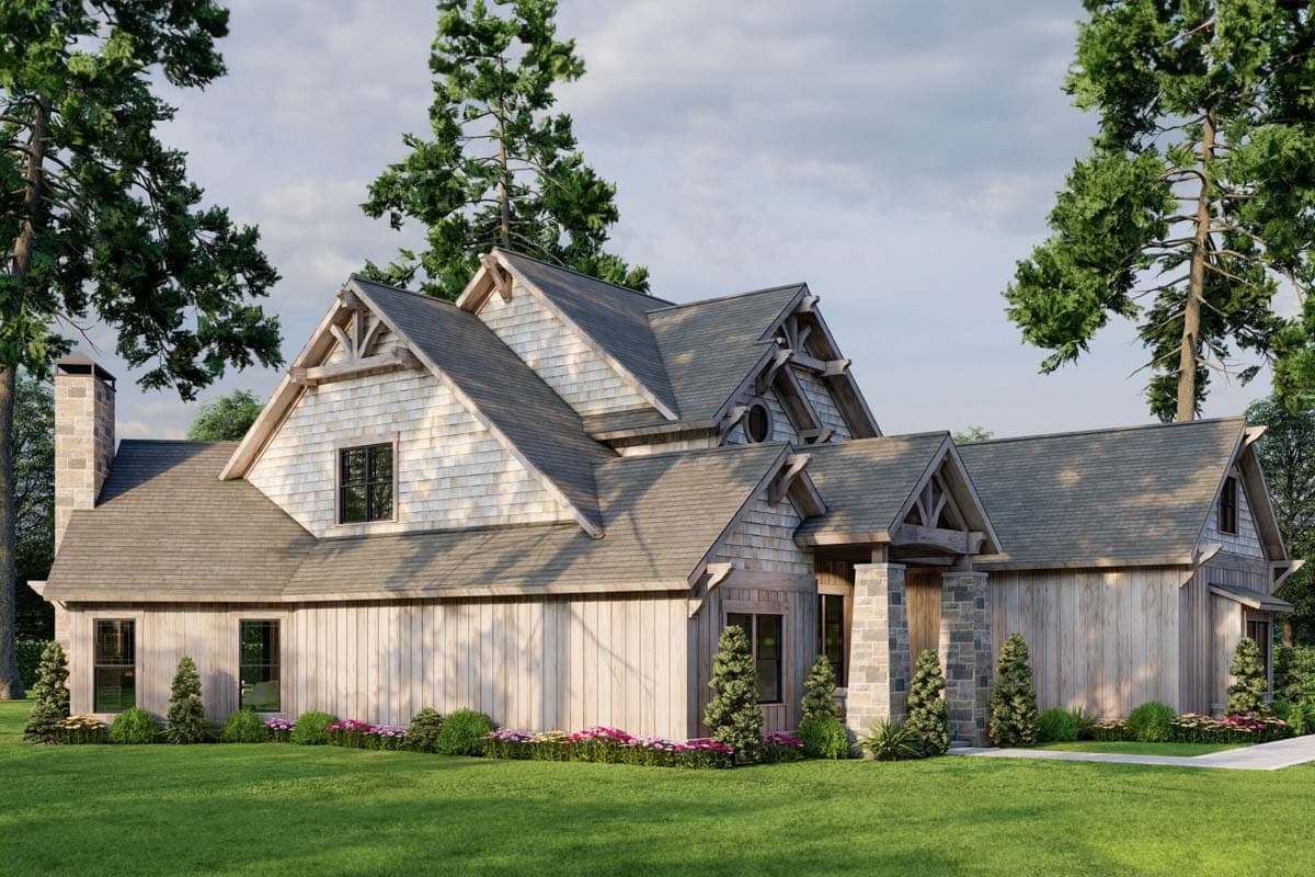 House plan exterior: Craftsman style, two stories, stone chimney, timber frame accents, and varied rooflines.