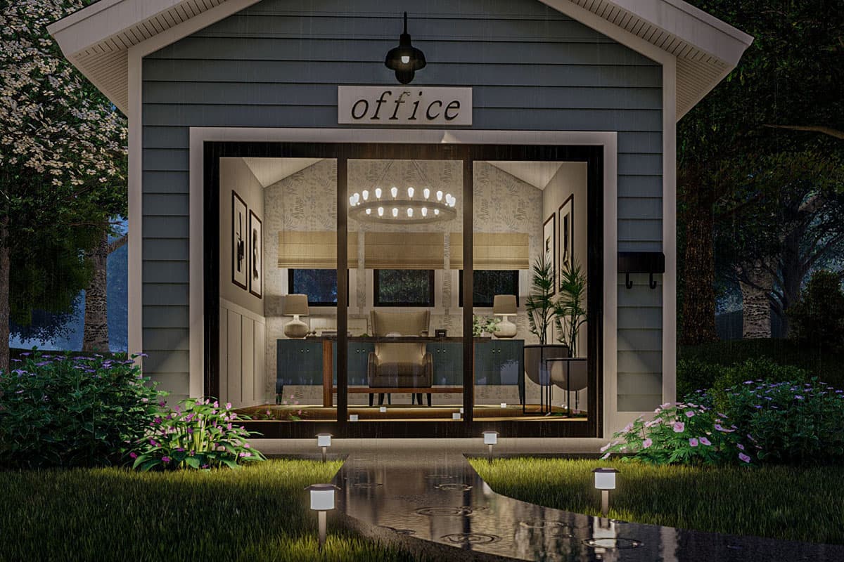Exterior of a one-story office building with horizontal siding, large glass doors, and a pitched roof.
