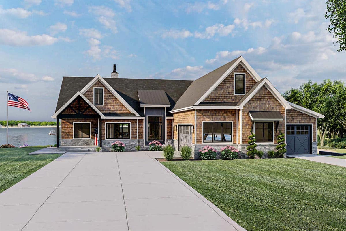 House plan exterior with Craftsman style, featuring multiple gables, shake siding, and a two-car garage. Stone facade accents the foundation.