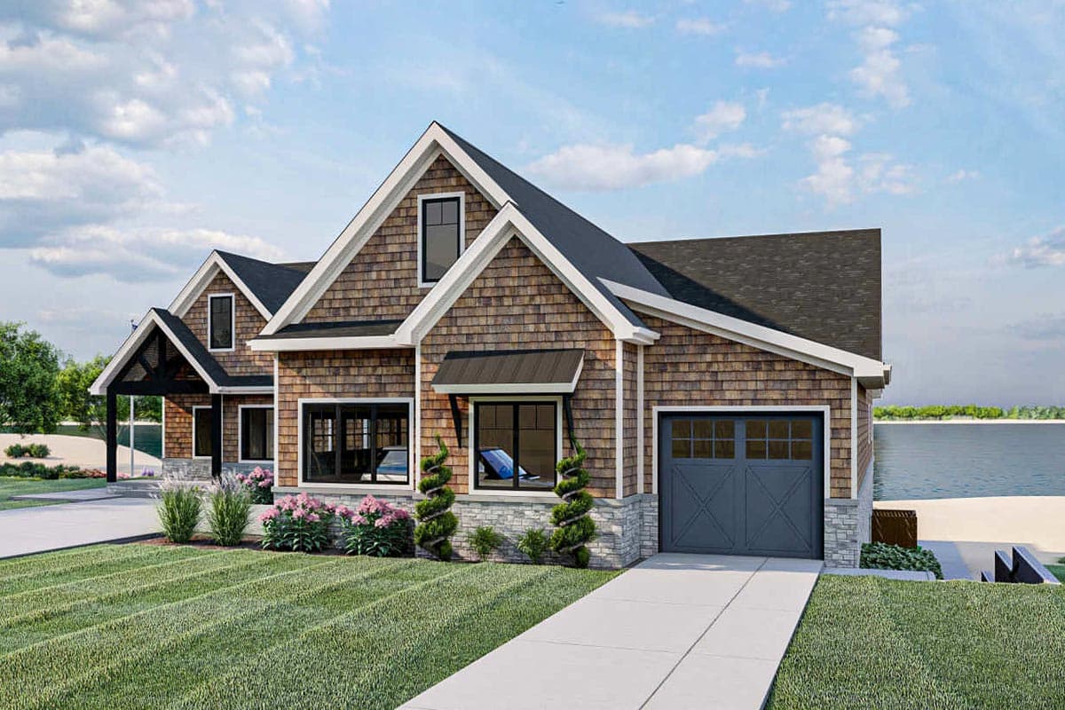 House plan exterior features shake siding, stone accents, prominent gables, dormers, and a side-entry garage.