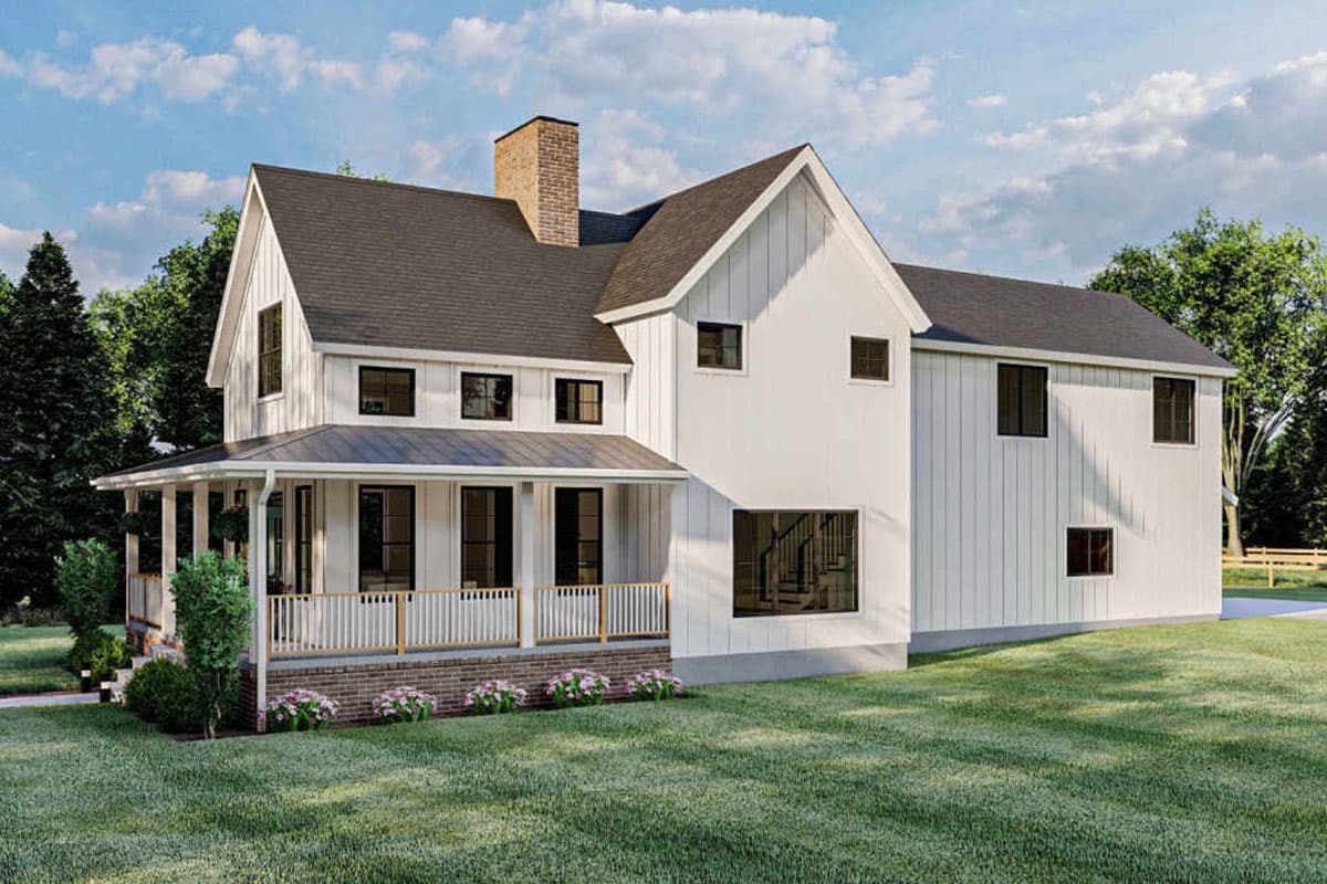Modern Farmhouse house plan exterior: two stories, white vertical siding, prominent gable, wrap-around porch, and brick foundation.
