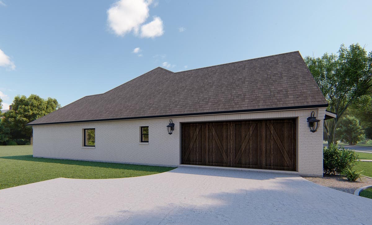 House plan exterior: Single-story brick home with a multi-gable roofline and a large, rustic double garage door.