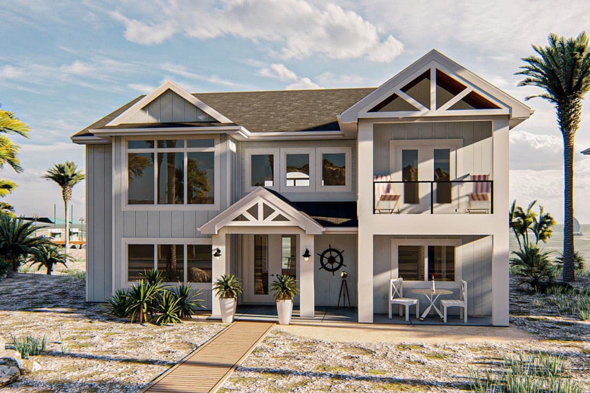 House plan exterior. Two-story coastal-style home with multiple gables, balcony, and large windows. Features a front entry porch and wooden walkway.