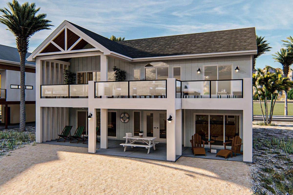 House plan exterior with two stories, gabled roof, balconies, and covered ground-level patio with seating.