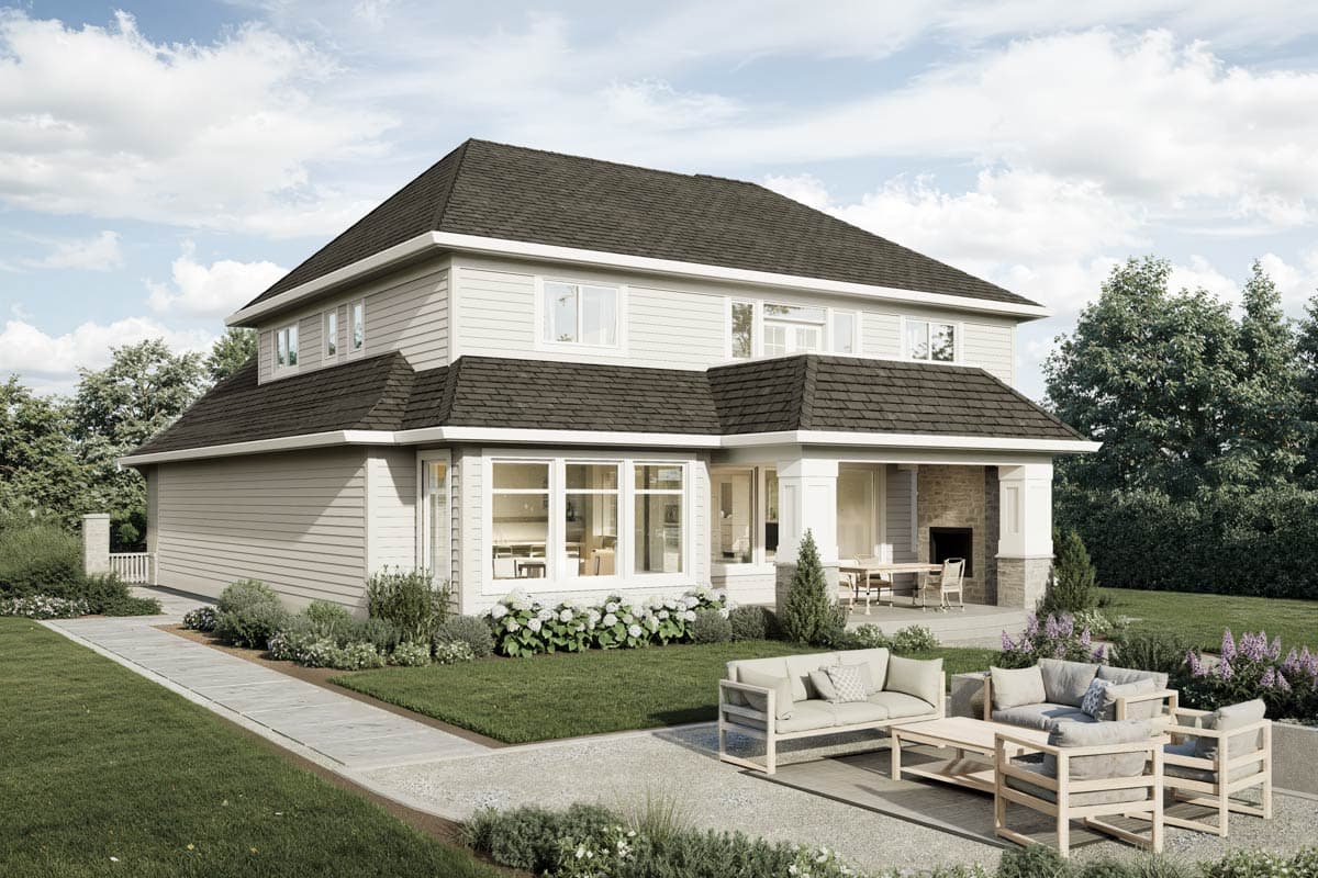 House plan exterior: Two-story home with gabled roofs, covered porch with stone fireplace, and large bay windows.