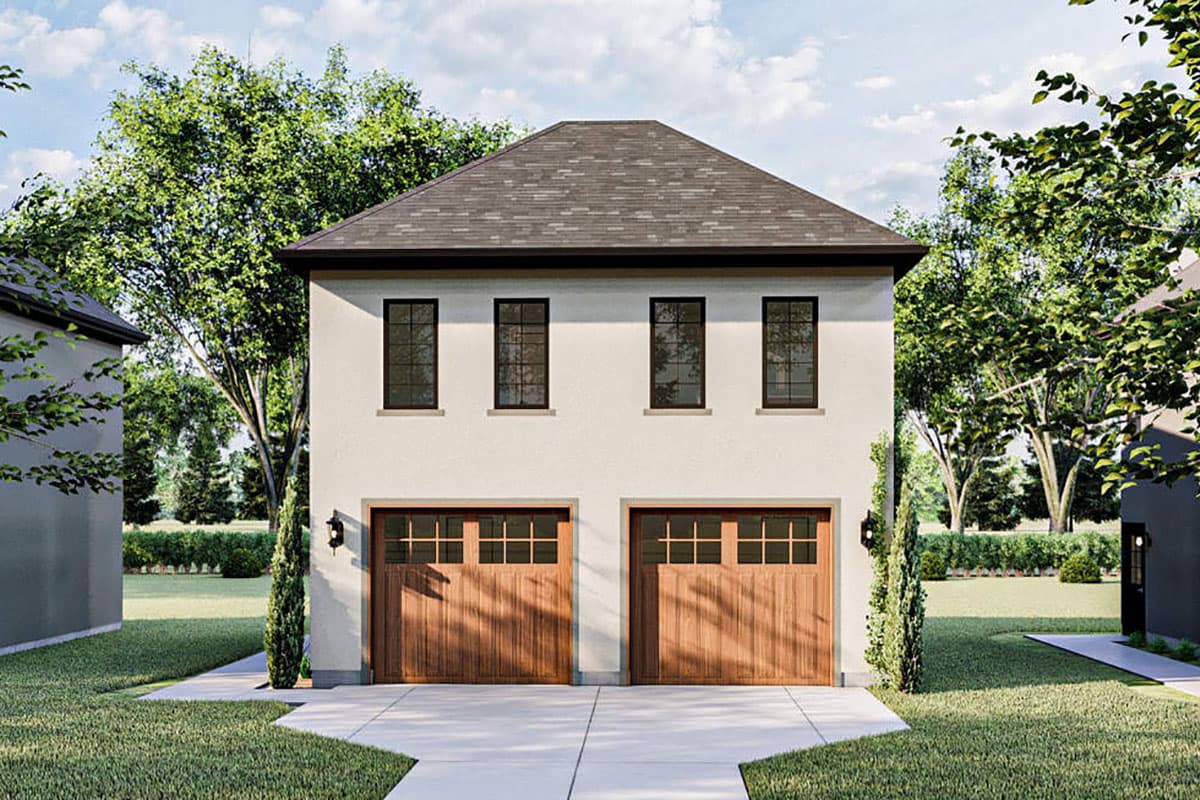 House plan exterior with two stories. Features include a gabled roof, two garage doors, and four second-story windows.