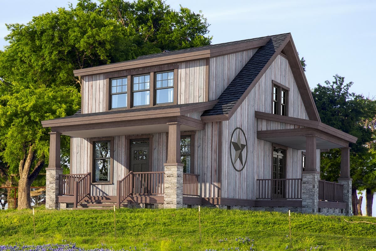 House plan exterior. Two-story farmhouse with a front porch, gabled roof, and wood siding. Stone columns support the porch.
