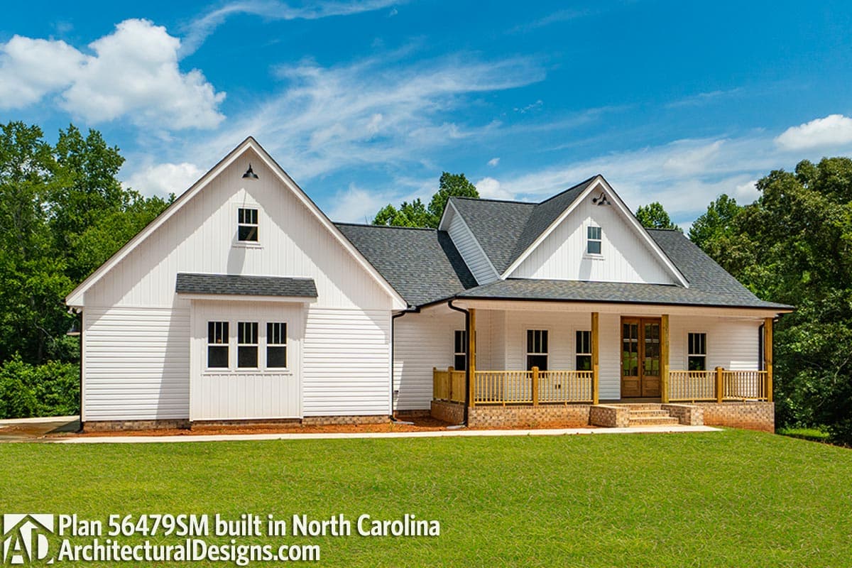 House plan exterior: Modern Farmhouse style, 1.5 stories, with gables, dormers, covered porch, and horizontal siding.