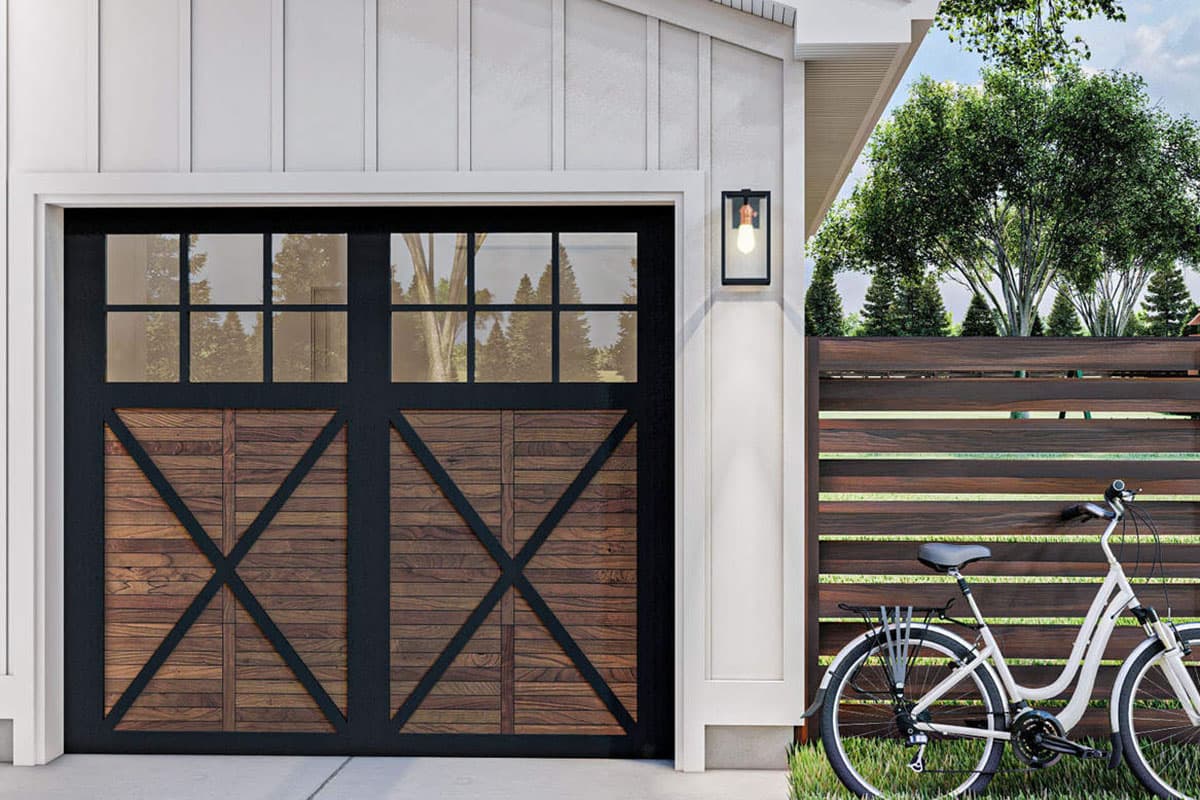 House plan exterior features a Modern Farmhouse garage door with wood panels and a black grid of windows. Sidelight fixture present.