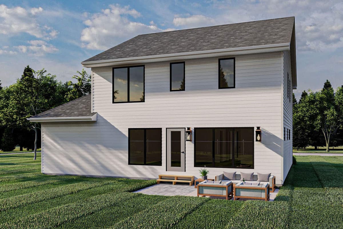 Two-story house plan exterior with white horizontal siding, dark-framed windows, and a gabled roof.