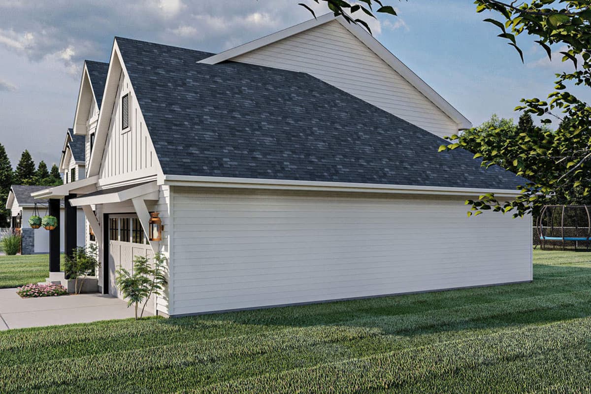 House plan exterior view of a modern farmhouse style home with gabled dormers, a covered entry, and a side-facing garage.