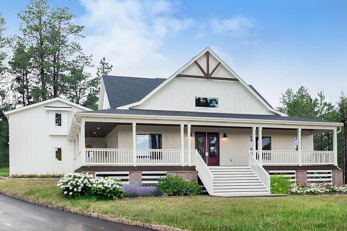 House plan exterior. Modern Farmhouse style with a two-story layout, featuring a wraparound porch, gabled roof, and dormer window.