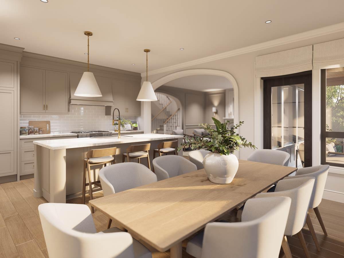 Open concept kitchen and dining area with island, vaulted ceiling, and large arched doorway leading to a living room.