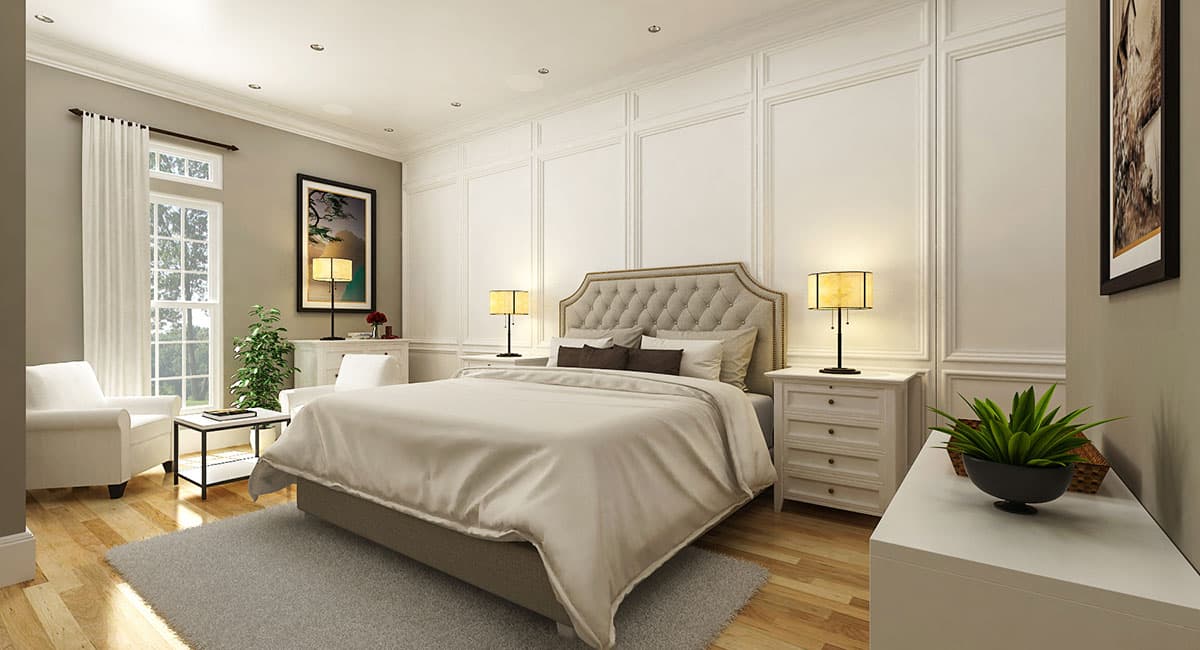 Bedroom with tufted headboard, ornate wall paneling, large window, seating area, and wood floors.