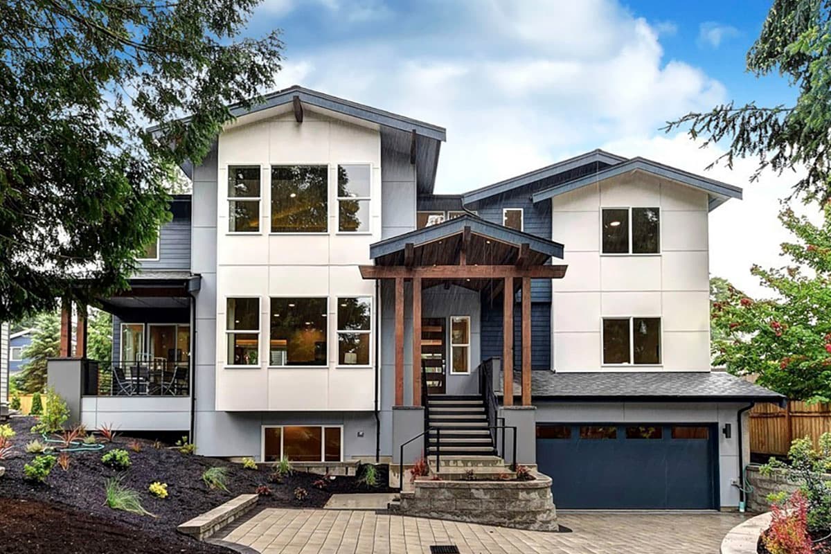 House plan exterior featuring Modern style, two stories, covered entry porch, gabled rooflines, and attached garage.